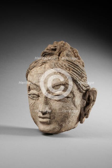 Head of a female. From Ajina Tepe, 7th-8th century. Creator: Central Asian Art.
