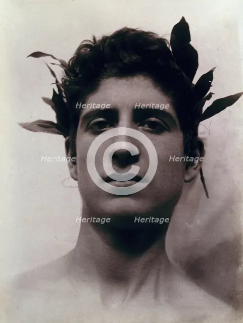 Head of a Sicilian boy posing, crowned with laurel leaves, March 1902. Creator: Count Wilhelm von Gloeden.