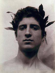Head of a Sicilian boy posing, crowned with laurel leaves, March 1902. Creator: Count Wilhelm von Gloeden