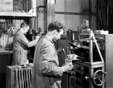 Heading at the Edgar Allen Steel Foundry, Sheffield, South Yorkshire, 1962. Creator: Michael Walters