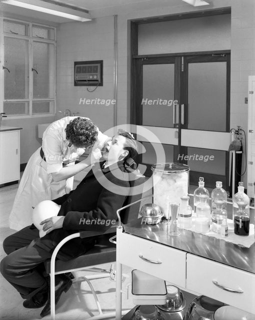 Health check in the medical room, Park Gate Iron & Steel Co, Rotherham, South Yorkshire, 1964. Creator: Michael Walters.