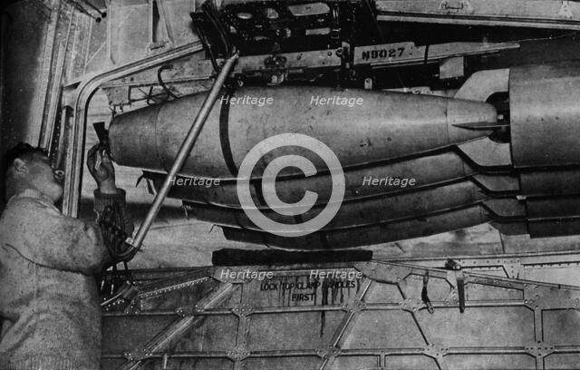 Heavy bombs in the racks of a RAF Short Sunderland flying boat, c1940 (1943). Artist: Unknown.