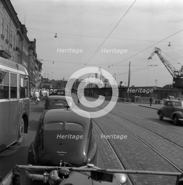 Heavy traffic outside the Royal Palace, Stockholm, Sweden, 1950. Creator: Torkel Lindeberg.