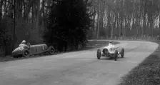 Hector Dobbs Riley Dobbs offset special passing Raymond Mays crashed ERA, Donington Park, 1935. Artist: Bill Brunell