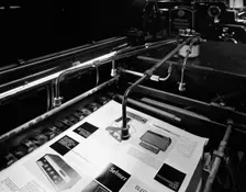 Heidleberg cylinder press in operation at a printworks, Mexborough, South Yorkshire, 1959. Creator: Michael Walters
