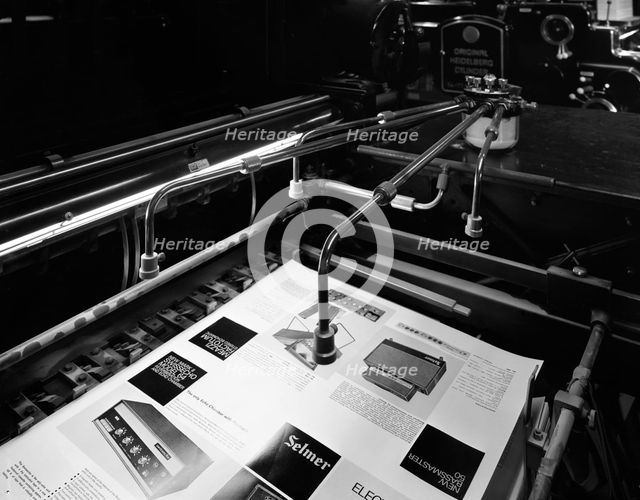 Heidleberg cylinder press in operation at a printworks, Mexborough, South Yorkshire, 1959. Artist: Michael Walters