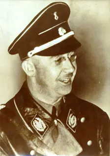 Heinrich Himmler in early SS uniform (black tie and cap) with the rank of Oberführer, 1933. Creator: Unknown