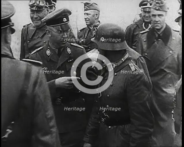 Heinrich Himmler Standing Next to and Pointing Towards a German Army Commander With..., 1939. Creator: British Pathe Ltd.