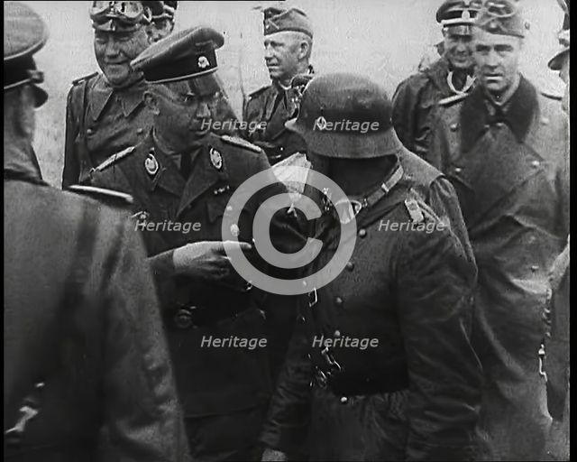 Heinrich Himmler Standing Next to and Pointing Towards a German Army Commander With..., 1939. Creator: British Pathe Ltd.