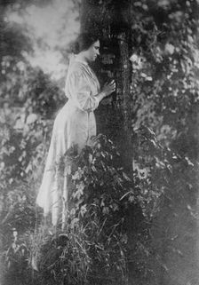 Helen Keller, standing next to tree, 1912. Creator: Bain News Service