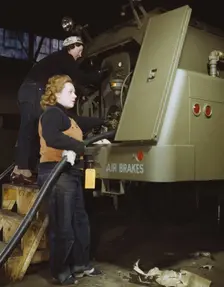 Helen Ryan, age 41 (with cap), widow and used to work..., Heil and Co., Milwaukee, Wisconsin, 1943. Creator: Howard Hollem