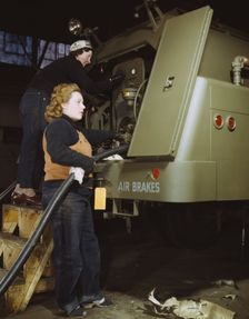 Helen Ryan, age 41 (with cap), widow and used to work..., Heil and Co., Milwaukee, Wisconsin, 1943. Creator: Howard Hollem