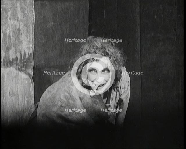 Helen Tree Performing in Heavy Makeup and Smoking a Pipe, 1922. Creator: British Pathe Ltd.