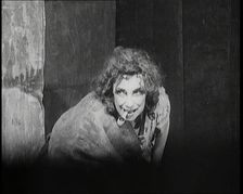 Helen Tree Performing in Heavy Makeup and Smoking a Pipe, 1922. Creator: British Pathe Ltd