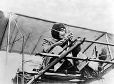 Hélène Dutrieu at the controls of her plane, c.1911