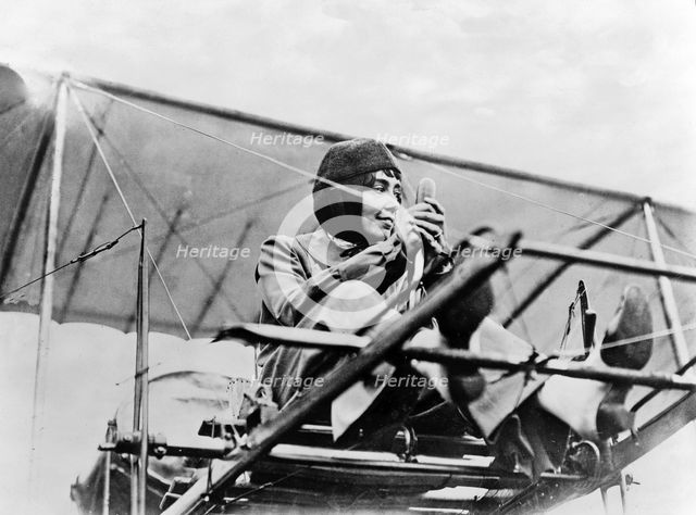 Hélène Dutrieu at the controls of her plane, c.1911.
