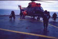 Helicopter on an aircraft carrier, Falklands War, 1982. Creator: Luis Rosendo