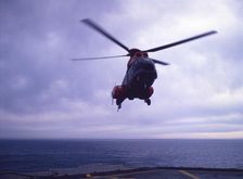 Helicopter on an aircraft carrier, Falklands War, 1982. Creator: Luis Rosendo