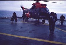 Helicopter on an aircraft carrier, Falklands War, 1982. Creator: Luis Rosendo