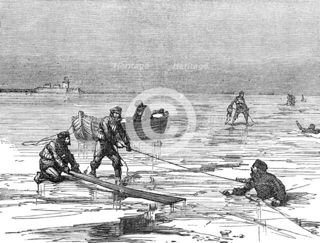 Helping strugglers in the ice-holes, 1874. Creator: Unknown.