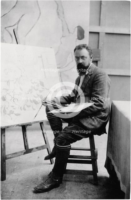 Henri Matisse in his studio in Issy-les-Moulineaux, 1909. Creator: Manuel, Henri (1874-1947).