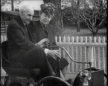 Henry and Clara Ford Sitting in an Old Motorcar, 1921. Creator: British Pathe Ltd