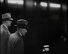 Henry Ford Walking Along a Train Station Platform, 1930s. Creator: British Pathe Ltd