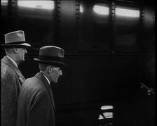 Henry Ford Walking Along a Train Station Platform, 1930s. Creator: British Pathe Ltd