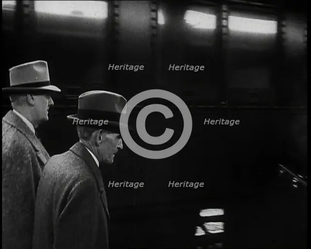 Henry Ford Walking Along a Train Station Platform, 1930s. Creator: British Pathe Ltd.