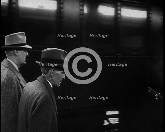 Henry Ford Walking Along a Train Station Platform, 1930s. Creator: British Pathe Ltd.