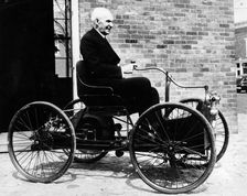 Henry Ford on a 1896 Ford, (c1940s?)