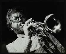 Henry Lowther playing the trumpet at The Stables, Wavendon, Buckinghamshire. Artist: Denis Williams
