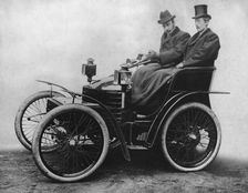 Herbert Austin at tiller of first 4 wheel Wolseley 1899. Creator: Unknown