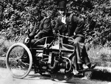 Herbert Austin (left) on 1897 Wolseley Tricar. Creator: Unknown