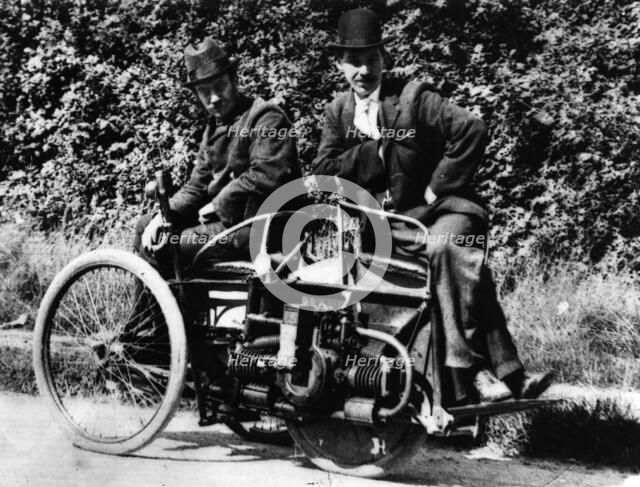 Herbert Austin (left) on 1897 Wolseley Tricar. Creator: Unknown.