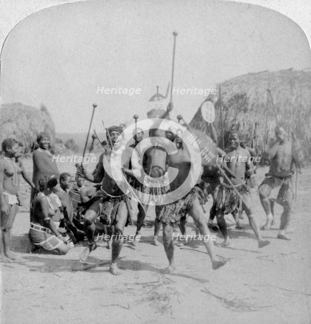 'Heroic sports of the Kraal, a Zulu war dance', Zululand, South Africa, 1901. Artist: Underwood & Underwood