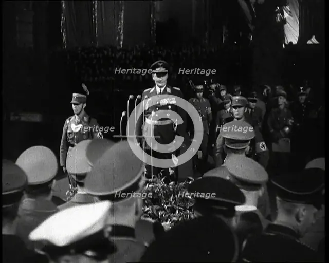 Hermann Goering Standing Before Microphones on a Decorated Dais...,1937 Creator: British Pathe Ltd.
