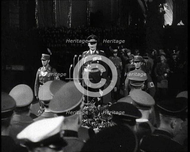 Hermann Goering Standing Before Microphones on a Decorated Dais...,1937 Creator: British Pathe Ltd.