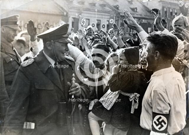 Hermann Göring, German Nazi politician and military leader, taking the salute, c1930s-c1940s. Artist: Unknown