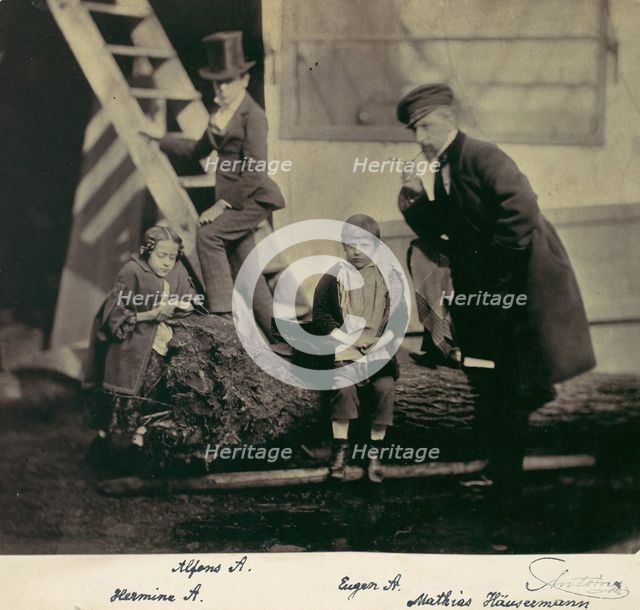 [Hermine, Alfons and Eugen Antoine and Mathias Höusermann on a fallen tree], 1850s-60s. Creator: Franz Antoine.