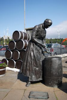 Herring Girl statue, Stornoway harbour, Isle of Lewis, Outer Hebrides, Scotland, 2009. Creator: Peter Thompson