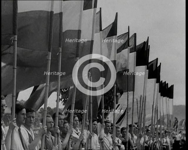Hitler Youth Members Holding Flags, 1930s. Creator: British Pathe Ltd.