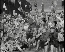 Hitler Youth Boys Engaging in Sporting Activities at a Camp, 1930s. Creator: British Pathe Ltd