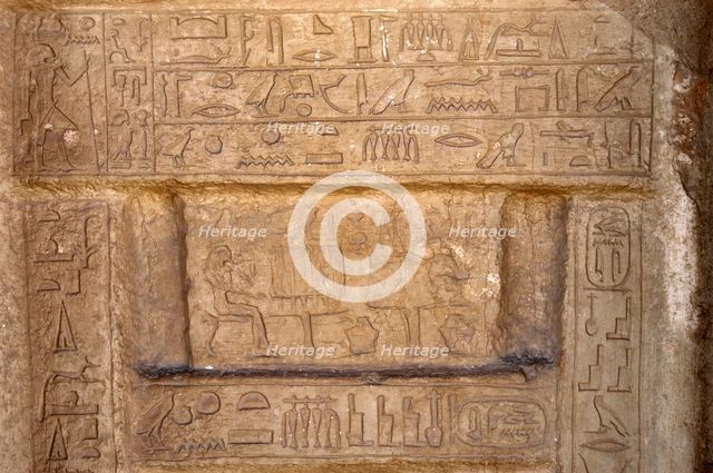 Hieroglyphic writing and deceased ofering food to the gods, Necropolis of Saqqara, Egypt, 2003. Creator: Unknown.