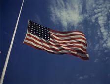 High above, over a true "home of the brave," the floating folds of the Star..., Fort Knox, Ky., 1942 Creator: Alfred T Palmer
