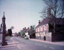 High Street and war memorial, Burwash, Sussex, c1955. Creator: Arthur Charles Kirby Ware