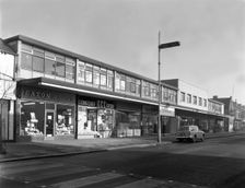High street shopping, Goldthorpe, South Yorkshire, 1961. Creator: Michael Walters