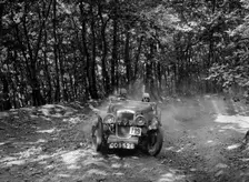 Hillman Aero Minx competing in the B&HMC Brighton-Beer Trial, Fingle Bridge Hill, Devon, 1934. Artist: Bill Brunell