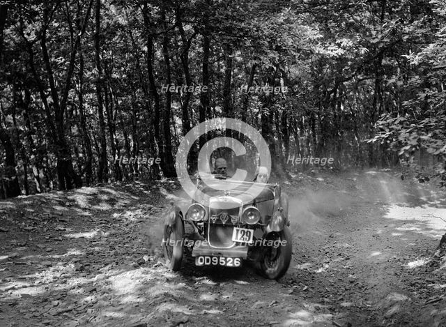 Hillman Aero Minx competing in the B&HMC Brighton-Beer Trial, Fingle Bridge Hill, Devon, 1934. Artist: Bill Brunell.