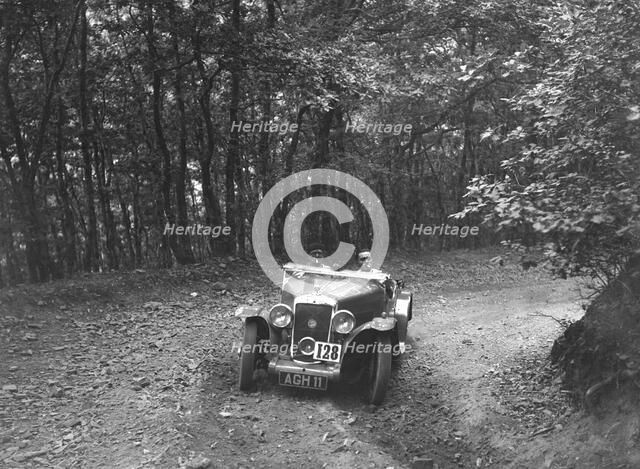 Hillman Aero Minx competing in the B&HMC Brighton-Beer Trial, Fingle Bridge Hill, Devon, 1934. Artist: Bill Brunell.